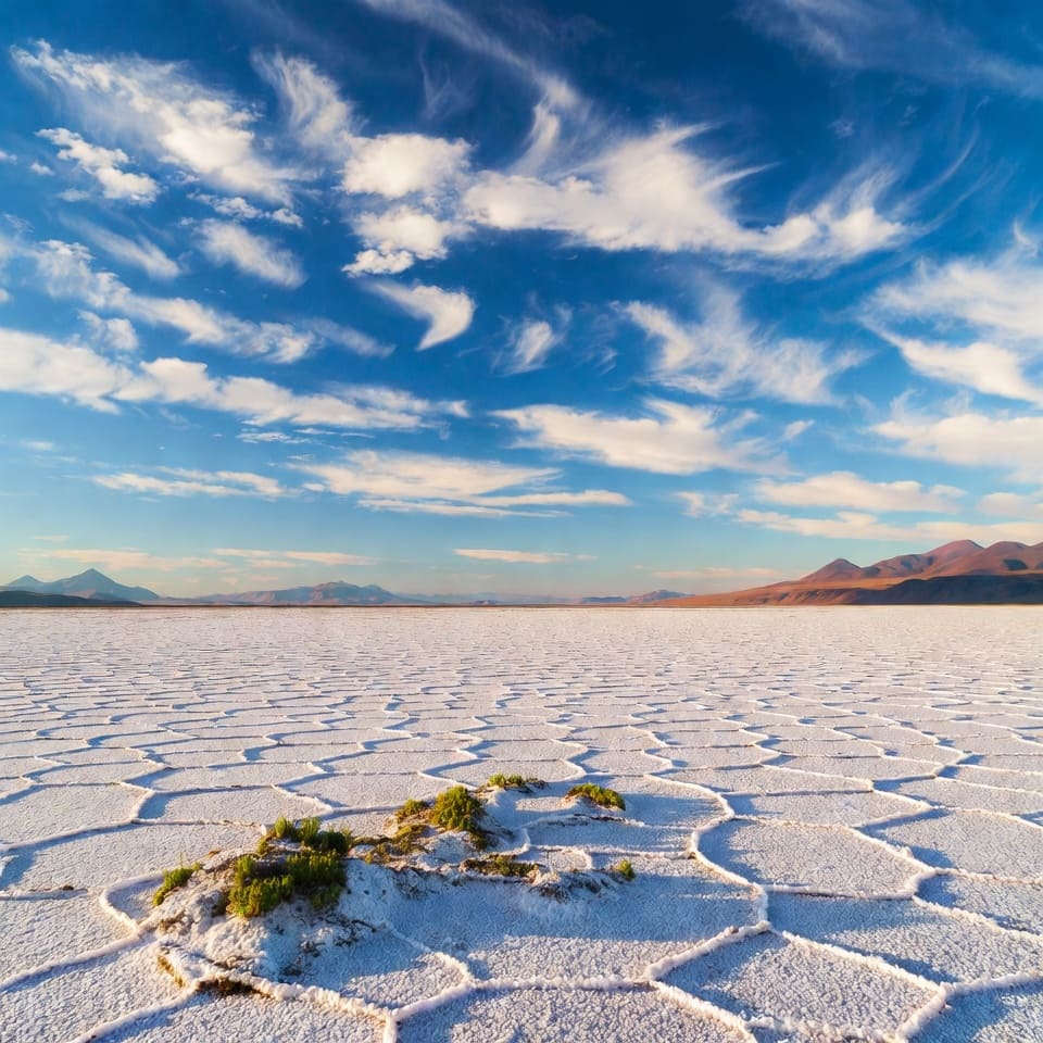 Uyuni Salt Flats mirror effect with sky reflection during rainy season